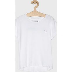 Tommy Hilfiger - Top dziecięcy 128-176 cm. Białe bluzki dziewczęce TOMMY HILFIGER, bez wzorów, z bawełny, z okrągłym kołnierzem, z krótkim rękawem, krótkie, bez kaptura. Za 139,90 zł.