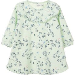 Sukienka "Tea" w kolorze miętowym. Niebieskie sukienki niemowlęce marki name it girls, bez wzorów, bez rękawów, midi. W wyprzedaży za 49,95 zł.