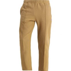 Spodnie dresowe męskie: Champion Reverse Weave STRAIGHT WEAVE TRACK PANTS Spodnie treningowe dark yellow
