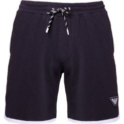 Emporio Armani Spodnie treningowe blue navy. Niebieskie spodnie męskie Emporio Armani, xxl, bez wzorów, z bawełny. W wyprzedaży za 554,25 zł.