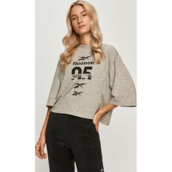 Reebok - T-shirt. Szare topy damskie Reebok, s, z nadrukiem, z elastanu, z krótkim rękawem. Za 119,90 zł.