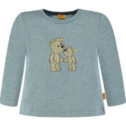 Koszulka w kolorze niebieskim. Niebieskie t-shirty chłopięce z długim rękawem marki Steiff, z aplikacjami, z okrągłym kołnierzem. W wyprzedaży za 49,95 zł.