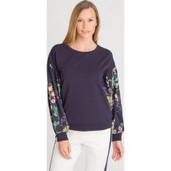 BLUZA LIU JO. Niebieskie bluzy damskie Liu Jo, s, z aplikacjami, z elastanu, bez rękawów, bez kaptura. Za 468,30 zł.