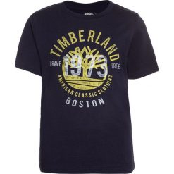 Timberland KURZARM 1973 Tshirt z nadrukiem marine. Niebieskie t-shirty męskie z nadrukiem Timberland, z bawełny. Za 129,00 zł.