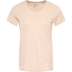Koszulka techniczna NIKE City Sleek CJ9444. Brązowe koszulki damskie polo Nike, s, bez wzorów, z poliesteru, bez rękawów. Za 169,00 zł.