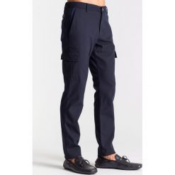 Granatowe spodnie tkaninowe z kieszeniami. Niebieskie spodnie męskie JOOP! Jeans, na imprezę, m, bez wzorów, z tkaniny. Za 299,60 zł.