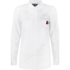Tommy Hilfiger Koszula "Guida". Koszulki damskie TOMMY HILFIGER, bez wzorów, z tkaniny, bez rękawów. Za 279,00 zł.