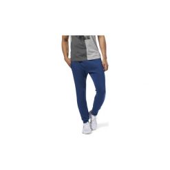 Spodnie treningowe Reebok Sport Spodnie Training Essentials Marble. Niebieskie spodnie męskie Reebok Sport, xl, bez wzorów, sportowe. Za 199,00 zł.