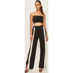 Fila - Spodnie. Niebieskie spodnie damskie Fila, s, z aplikacjami, z poliesteru. Za 299,90 zł.