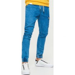 Jeansy SLIM JOGGER - Niebieski. Niebieskie jeansy męskie slim Cropp. Za 129,99 zł.