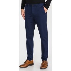 Scotch & Soda Mott Spodnie Niebieski. Niebieskie spodnie męskie Scotch & Soda, bez wzorów, z elastanu. Za 400,95 zł.