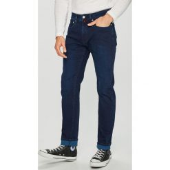 Pierre Cardin - Jeansy Lyon. Niebieskie jeansy męskie marki Pierre Cardin, z aplikacjami, z podwyższonym stanem. W wyprzedaży za 299,90 zł.