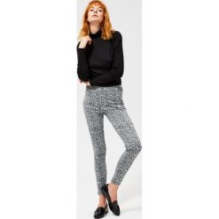 Legginsy w wężową skórę. Czarne spodnie damskie Moodo, xs, z nadrukiem, z elastanu. Za 34,99 zł.