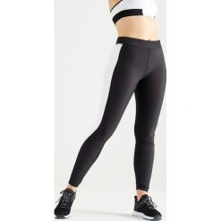 Legginsy fitness cardio damskie. Czarne legginsy sportowe damskie DOMYOS, l, bez wzorów, z elastanu, na fitness i siłownię. Za 64,99 zł.