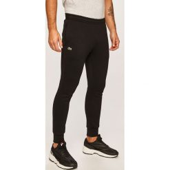 Lacoste - Spodnie. Niebieskie spodnie męskie Lacoste, na co dzień, xxl, bez wzorów, z elastanu, casualowe. W wyprzedaży za 319,90 zł.