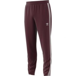 MĘSKIE SPODNIE DRESOWE ADIDAS BECKENBAUER (M). Spodnie męskie Adidas, m, w paski, z dresówki, retro. W wyprzedaży za 199,99 zł.