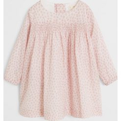 Mango Kids - Sukienka dziecięca Ana 62-80 cm. Różowe sukienki dziewczęce Mango Kids, bez wzorów, z bawełny, casualowe, bez rękawów, rozkloszowane. W wyprzedaży za 49,90 zł.