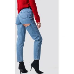 Luisa Lion x NA-KD Jeansy z rozdarciem - Blue. Niebieskie spodnie z wysokim stanem marki Luisa Lion x NA-KD, z jeansu. Za 202,95 zł.