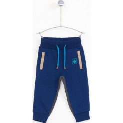 Lemon Explore - Spodnie dziecięce 86-116 cm. Niebieskie spodnie chłopięce marki LEMON explore, bez wzorów, z bawełny, sportowe. W wyprzedaży za 54,90 zł.