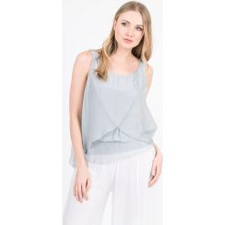Top "New York" w kolorze szarym. Szare bluzki damskie Scherrer Soie, s, bez wzorów, z okrągłym kołnierzem. W wyprzedaży za 128,95 zł.