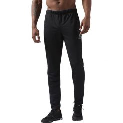 SPODNIE REEBOK WORKOUT READY TRACKSTER (XL). Spodnie męskie Reebok, na imprezę, s, bez wzorów, ze skóry, sportowe. W wyprzedaży za 119,99 zł.