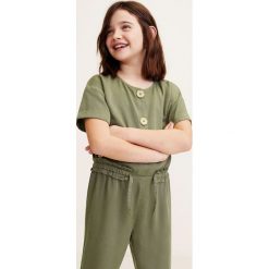 Mango Kids - Kombinezon dziecięcy Vego 110-164 cm. Żółte kombinezony dziewczęce Mango Kids, bez wzorów, z lyocellu, z krótkim rękawem, krótkie. Za 129,90 zł.