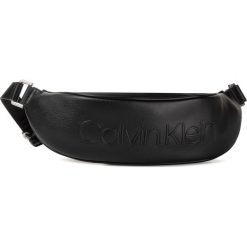 Saszetka nerka CALVIN KLEIN - Rapid Urban Xbody K60K605597 Black. Czarne nerki damskie Calvin Klein, bez wzorów, ze skóry ekologicznej, młodzieżowe, bez dodatków. Za 359,00 zł.