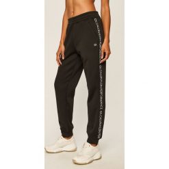 Calvin Klein Performance - Spodnie. Niebieskie spodnie damskie Calvin Klein Performance, s, bez wzorów, z poliesteru. Za 429,90 zł.