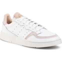 Buty adidas - Supercourt EE6034 Ftwwht/Ftwwht/Crywht. Białe buty sportowe męskie Adidas, na co dzień, bez wzorów, ze skóry, klasyczne, bez zapięcia. W wyprzedaży za 279,00 zł.