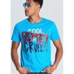 Koszulka Cool and cruel - Niebieski. Niebieskie koszulki męskie Cropp, s, bez wzorów, bez kołnierzyka, bez rękawów. Za 29,99 zł.