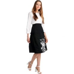 Spódnica - 129-2323 NERO. Czarne spódniczki damskie Unisono, s, z nadrukiem, z bawełny, eleganckie, rozkloszowane. Za 29,00 zł.