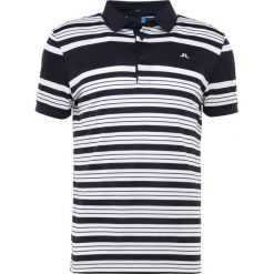 J.LINDEBERG RALFS STRIPED SLIM TX Koszulka sportowa navy. Niebieskie koszulki męskie marki J.LINDEBERG, s, bez wzorów, z poliesteru, polo, bez rękawów. Za 379,00 zł.