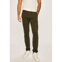 Tommy Hilfiger - Spodnie. Brązowe spodnie męskie TOMMY HILFIGER, na co dzień, bez wzorów, z elastanu, casualowe. Za 449,90 zł.