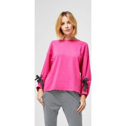 Bluzka typu oversize. Bluzki damskie Moodo, s, bez wzorów, bez kołnierzyka, bez rękawów. Za 34,99 zł.