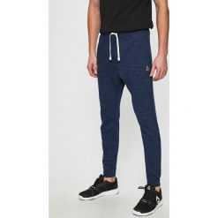 Reebok - Spodnie. Niebieskie spodnie męskie Reebok, s, bez wzorów, z elastanu, sportowe. Za 199,90 zł.