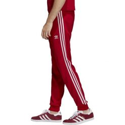 MĘSKIE SPODNIE DRESOWE ORIGINALS SST (L). Spodnie męskie Adidas, m, w paski, z poliesteru, klasyczne. W wyprzedaży za 229,99 zł.