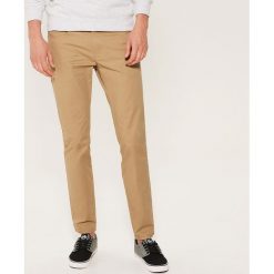 Materiałowe spodnie slim fit - Beżowy. Brązowe rurki męskie House, z materiału. Za 89,99 zł.