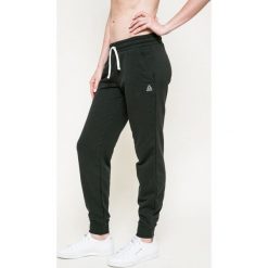Reebok - Spodnie. Czarne spodnie sportowe damskie marki Reebok, s, z bawełny. Za 149,90 zł.