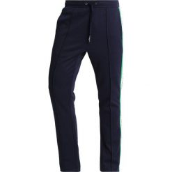 Calvin Klein Jeans SIDE STRIPE TRACK PANTS Spodnie treningowe dark blue. Niebieskie jeansy męskie marki Calvin Klein Jeans. Za 549,00 zł.