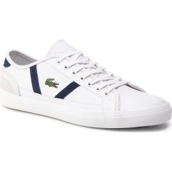 Tenisówki LACOSTE - Sideline 119 3 Cma Off 7-37CMA0068WN1 Wht/Nvy. Białe półbuty męskie marki Lacoste, na co dzień, bez wzorów, ze skóry, bez zapięcia. Za 399,99 zł.