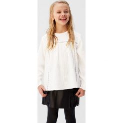 Mango Kids - Bluzka dziecięca Alan 110-164 cm. Białe bluzki dziewczęce Mango Kids, bez wzorów, z bawełny, z okrągłym kołnierzem, z długim rękawem, długie, bez kaptura. Za 79,90 zł.