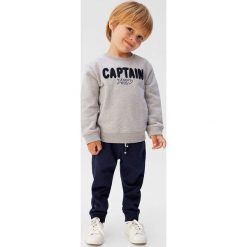 Mango Kids - Spodnie dziecięce Mateop5 80-104 cm. Żółte spodnie chłopięce Mango Kids, bez wzorów, z bawełny, casualowe. Za 35,90 zł.