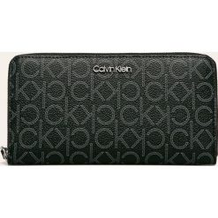 Calvin Klein - Portfel. Pomarańczowe portfele damskie Calvin Klein, bez wzorów, ze skóry ekologicznej. Za 299,90 zł.