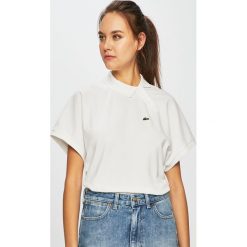 Lacoste - Top. Białe bluzki damskie marki Lacoste, bez wzorów, z elastanu, bez kołnierzyka. Za 599,90 zł.