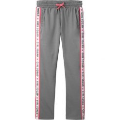 Spodnie sportowe z paskami z boku bonprix dymny szary. Szare spodnie dziewczęce bonprix, w paski, sportowe. Za 34,99 zł.