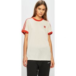 Adidas Originals - Top. Żółte topy damskie adidas Originals, bez wzorów, z poliesteru, casualowe, z okrągłym kołnierzem. W wyprzedaży za 129,90 zł.