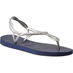 Sandały HAVAIANAS - Luna 41296970445 Navy Blue/Silver. Szare klapki damskie Havaianas, bez wzorów, z tworzywa sztucznego, bez obcasa. W wyprzedaży za 69,00 zł.