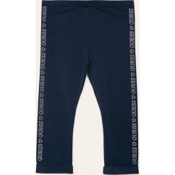 Guess Jeans - Legginsy dziecięce 118-175 cm. Niebieskie spodnie dziewczęce Guess Jeans, z aplikacjami, z elastanu. Za 99,90 zł.