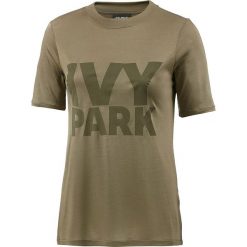 Koszulka w kolorze khaki. Brązowe koszulki damskie Street & Sports Wear, xs, z nadrukiem, z okrągłym kołnierzem. W wyprzedaży za 55,95 zł.