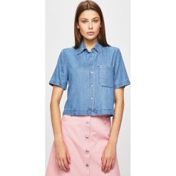 Calvin Klein Jeans - Koszula. Niebieskie bluzki damskie Calvin Klein Jeans, na co dzień, s, bez wzorów, z bawełny, klasyczne, z klasycznym kołnierzykiem, bez rękawów. W wyprzedaży za 179,90 zł.